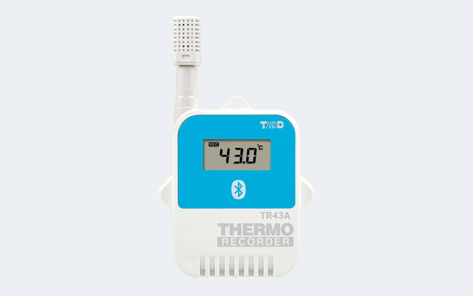 Registrador de temperatura T&D TR43A con conectividad Bluetooth, pantalla LCD y sensor externo, sobre fondo gris claro homogéneo